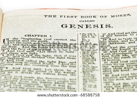 First verses of the Book of Genesis from an old family King James Bible. Includes the title.  On white.
