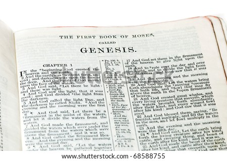 First verses of the Book of Genesis from an old family King James Bible. Includes the title.  On white.