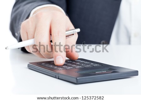 Business finance man calculating budget numbers with calculator
