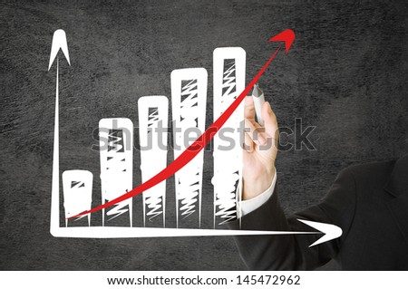 Businessman drawing rising graph with red arrow - success or strategy concept