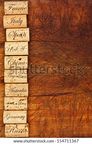 Wine cork border with the top ten Wine countries of the world on wooden background