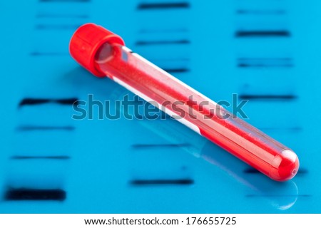 Blood sample vial on blue DNA test background