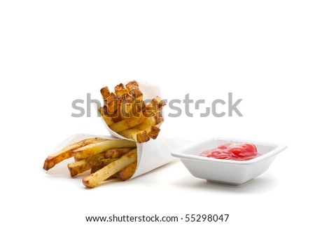 Two packs of home made french fries with ketchup over white background
