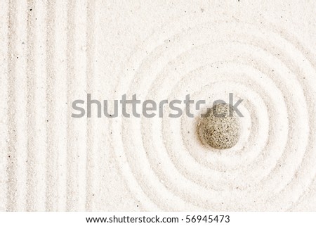Close up of sand zen garden with stone