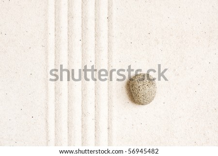 Close up of sand zen garden with stone