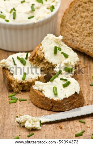 Delicious cream cheese on fresh sliced bread with chives