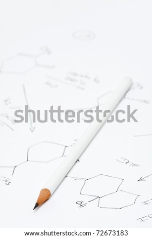 Pencil on piece of paper with chemical formula