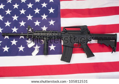 M4A1 assault rifle with blank dog tags on us flag