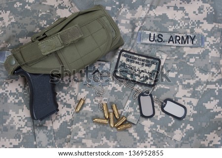 US  army concept with dog tags, camouflaged uniform with patches
