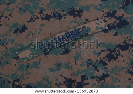 US  Marines concept with service tapes and camouflaged uniform