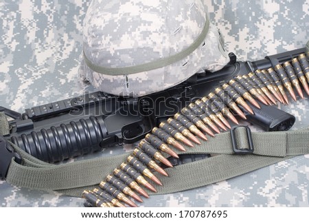 M4 carbine, kevlar helm on us army camouflage uniform