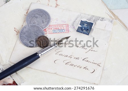 Vintage background with old paper, old ink pen, handwriten letters and silver coins