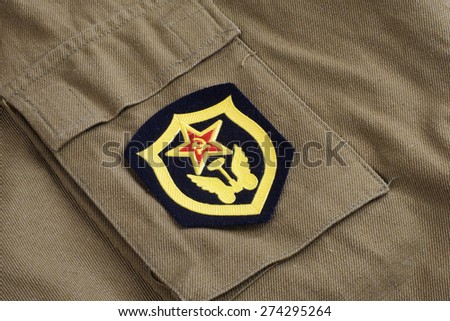 Soviet Army Transportation Corps shoulder patch on khaki uniform background