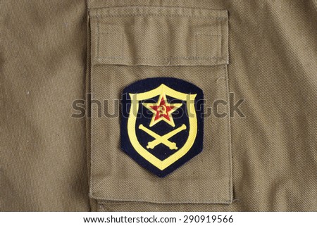 Soviet Army Artillery shoulder patch on khaki uniform background