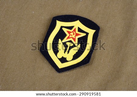 Soviet Army Transportation Corps shoulder patch on khaki uniform background