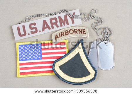 KIEV, UKRAINE - August 21, 2015.  US ARMY Private First Class rank patch, airborne tab, flag patch and dog tag