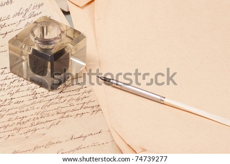 Vintage old papers, old ink pen, handwrite letters and old ink pot