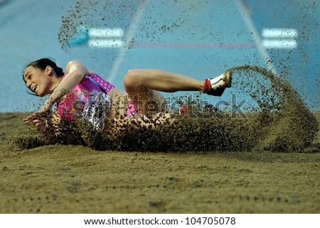 TURIN, ITALY - JUNE 08: Patricia Sarrapio ESP performs triple jump during the International Track & Field meeting Memorial Nebiolo 2012 on June 08, 2012 in Turin, Italy.