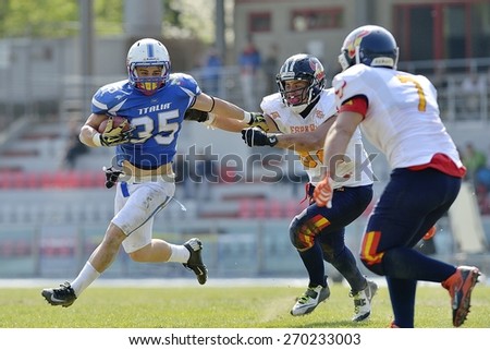 TURIN, ITALY - APRIL 12, 2015: CUOMO Valerio (left) run with ball. Italian U19 team win the qualifying match with Spain for European championship, in the Nebiolo Stadium in Turin.