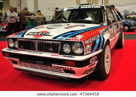 TURIN - FEB 14 : Lancia Delta HF Martini race car on display at the Automotoretra Auto Show on February 14, 2010 in Turin, Italy. The event is a great old and vintage auto shows in Italy.