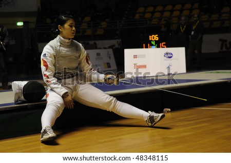 TURIN - FEB 7: Women Foil World Cup, Chinese fencer LE Huilin during a break of semifinal match of team tournament on  February 7, 2010 in Turin, Italy.
