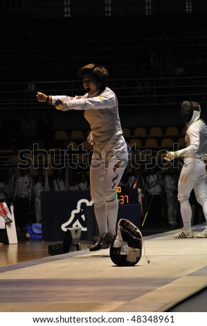 TURIN - FEB 7:  Women Foil World Cup, Chinese fencer DAI Huili fight wins semifinal match of team tournament on  February 7, 2010 in Turin, Italy.