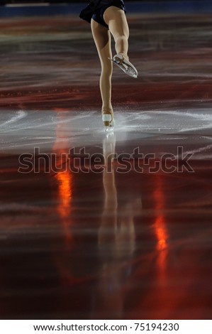 Ice figure skating woman legs on ice with shadows