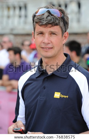 TURIN, ITALY - MAY 7: Former pro-biker (Italy) & current sports journalist, Paolo Savoldelli arrives before the first leg of the 2011 Giro Italia team time trials from Venaria Reale castle on May 07, 2011 in Turin, Italy.