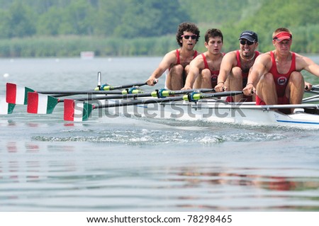 CANDIA, TURIN, ITALY - MAY 22: the CUS dei Laghi quad (quadruple) scull (4x) crew rowing during 2011 Rowing CNU University National Championship on May 22, 2011 on Candia lake, Turin, Italy