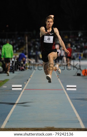 TURIN, ITALY - JUNE 10: Fedorov Aleksey (RUS) performs triple jump during the 2011 Memorial Primo Nebiolo track and field athletics international meeting, on June 10, 2011 in Turin, Italy.
