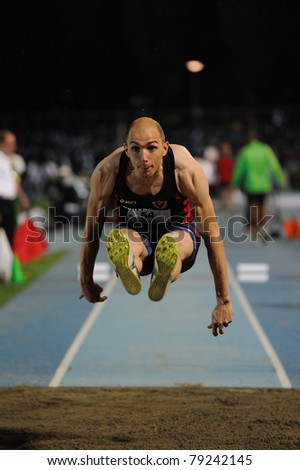 TURIN, ITALY - JUNE 10: Schembri Fabrizio (ITA) performs triple jump during the 2011 Memorial Primo Nebiolo track and field athletics international meeting, on June 10, 2011 in Turin, Italy.