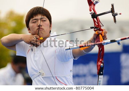 TURIN, ITALY - JULY 10: KIM Woojin (KOR), 2011 recurve men world champion, competes at round for gold at the 2011 World Archery and Para Archery Championships , on June 10, 2011 in Turin, Italy.