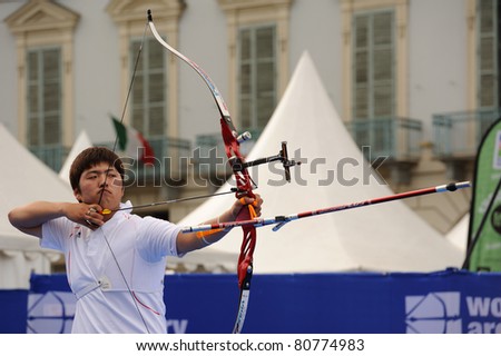 TURIN, ITALY - JULY 10: KIM Woojin (KOR), 2011 recurve men world champion, competes at round for gold at the 2011 World Archery and Para Archery Championships , on June 10, 2011 in Turin, Italy.