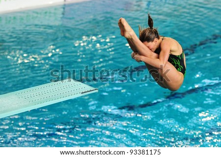 TURIN, ITALY - JANUARY 22: Francesca DallapÃ¨ competes at 1m diving board at 2012 Indoor diving italian championship on January 22, 2012 in Turin, Italy.