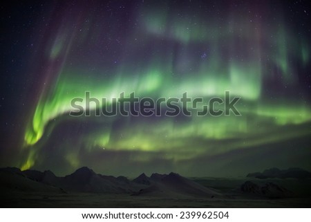 Beautiful Northern Lights across the sky - Arctic landscape