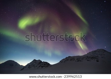 Northern Lights in the Arctic mountain landscape