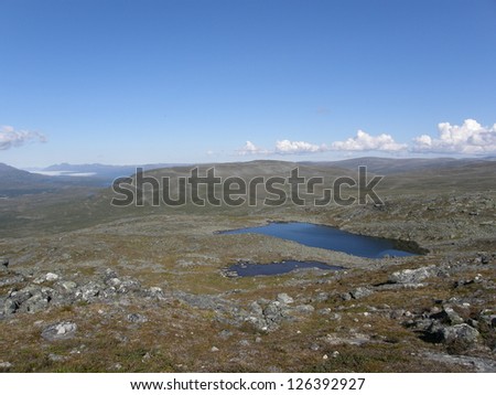 Arctic rocky desert and a lake on the top of Saana mountain, Lapland, Finland (Kilpisjarvi area)