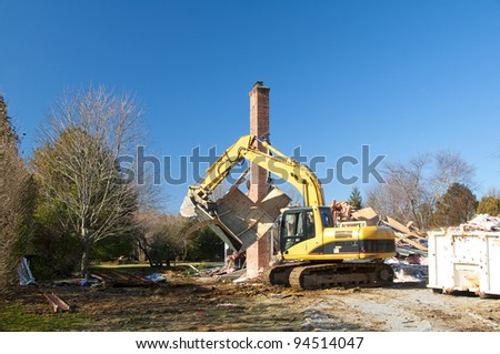 A house being demolished to make way for a new home