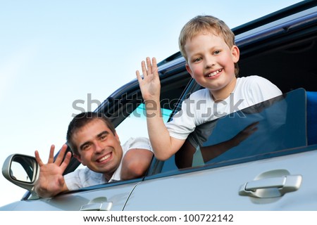 father and son in  the car