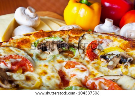 pizza with red tomato, mushrooms and cheese