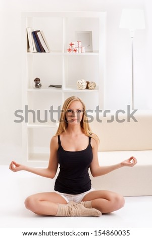 beauty girl doing yoga in the room