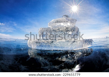 Boat made of ice on winter lake Baikal