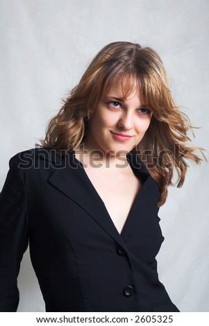 portrait of young woman in black coat (back lighting)