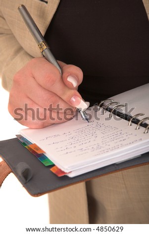 woman\'s hand with pen and notebook isolated