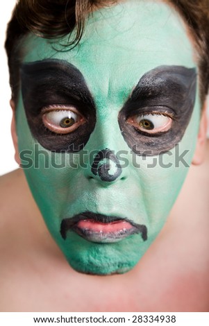 Man with scenic makeup showing sad emotions