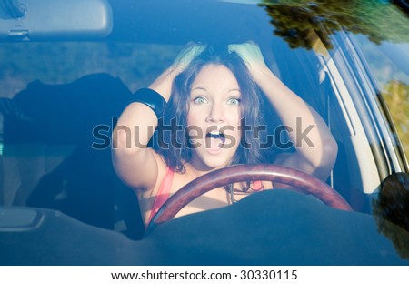 afraid girl into the car looking forward
