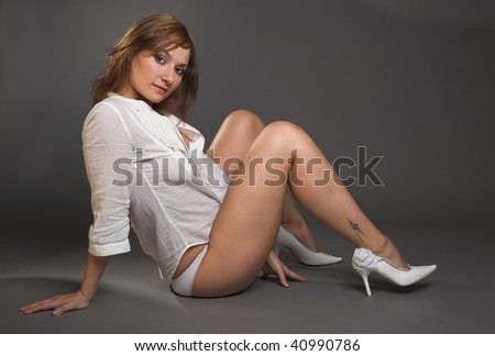 sexy woman in white blouse isolated on grey