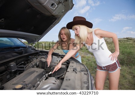 young beauty girls try to repair big car