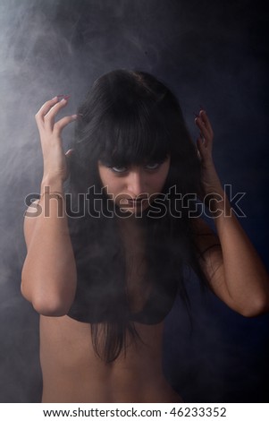 stressed beauty girl on the dark background