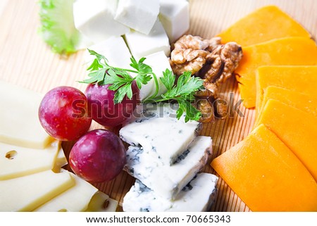 cheese and berry on the kitchen board